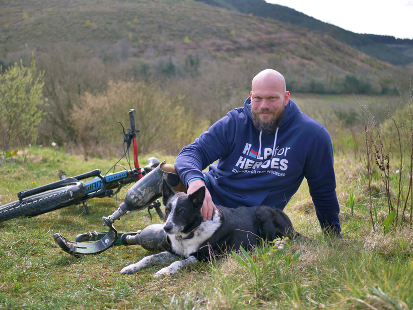 Bruce and his dog on top of a hill